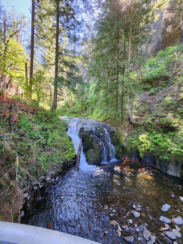 Water flowing over a rocky hillside — a visual of what it feels like to finally let go of what's been holding you back.