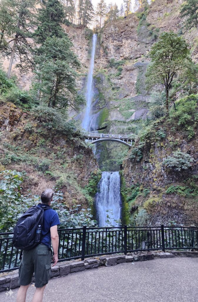 man in 50s on a hike at Multnomah 