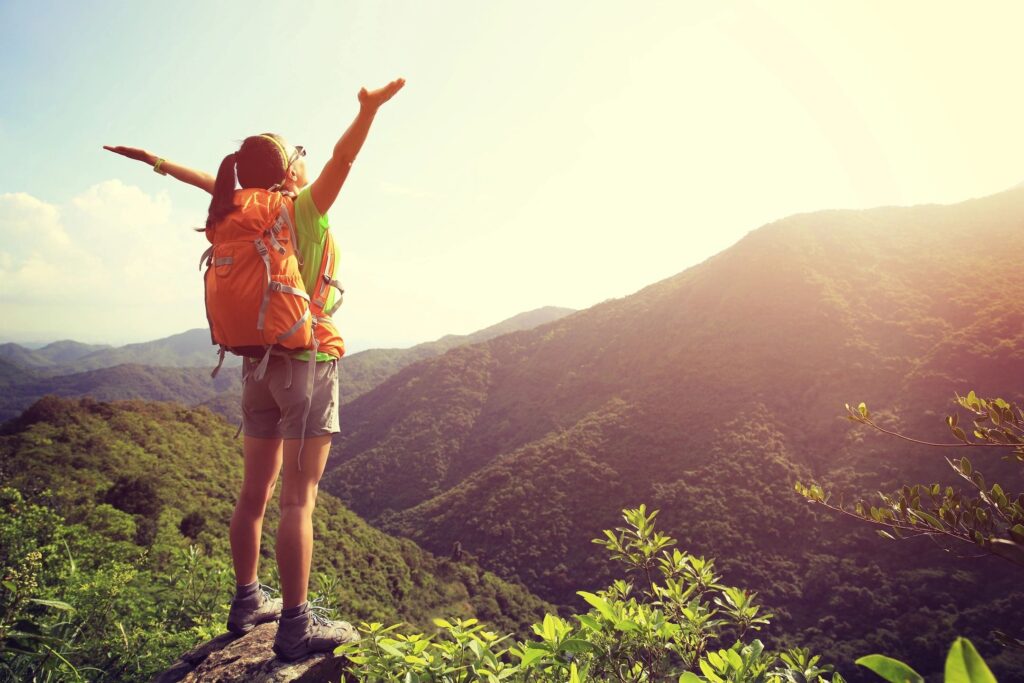 Woman in 40s with a pack on a hike