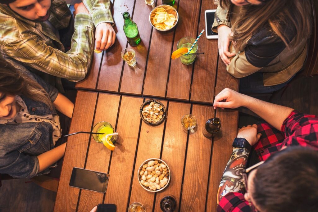 travel adventure: A small group of travelers laughing over dinner make things stress-free.