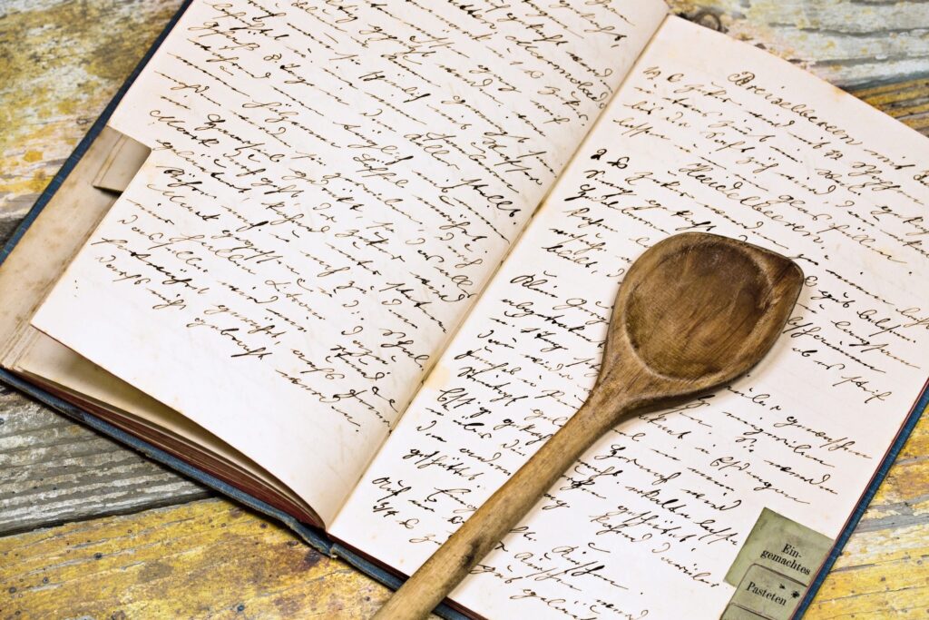 Recipe book with a wooden spoon resting on top