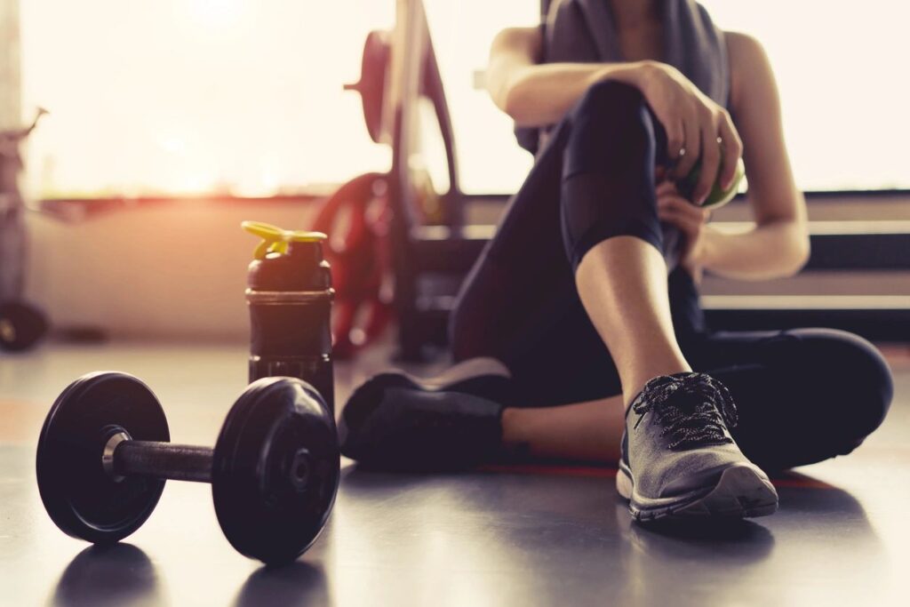 dumbell, woman resting