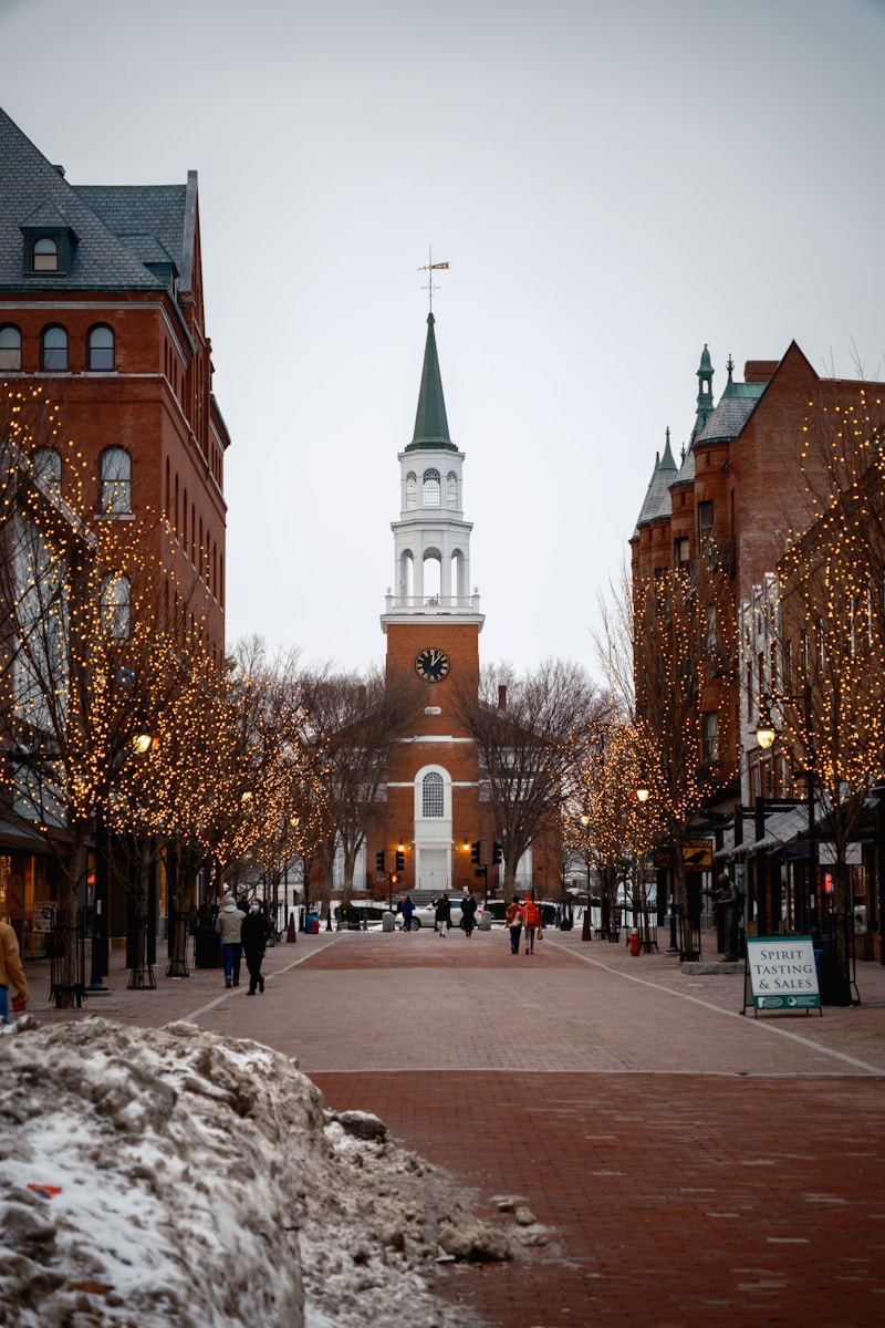 A city street with a clock tower in the background