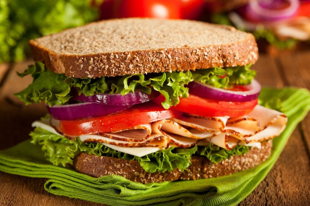 Plate with deli sandwiches simple, no-cook food ideas for your first week after moving.