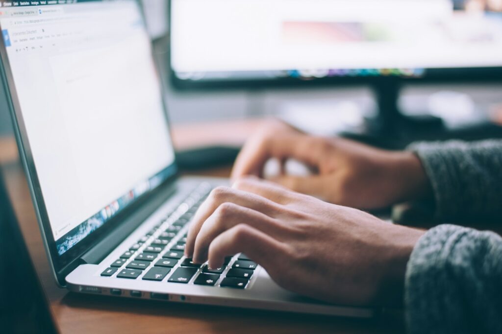 Starting over in career—laptop and resume on a desk