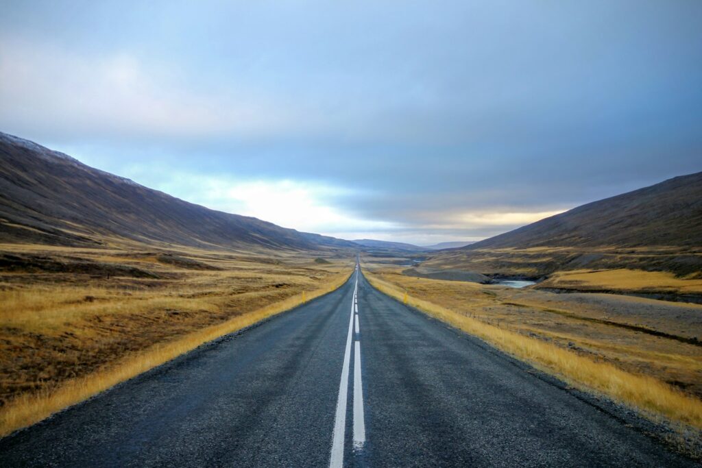 Symbol of becoming—open road on the horizon