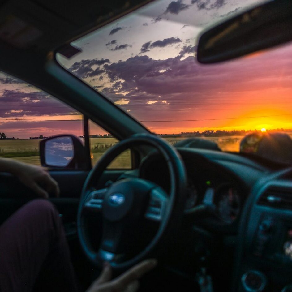 sitting inside car during golden hour