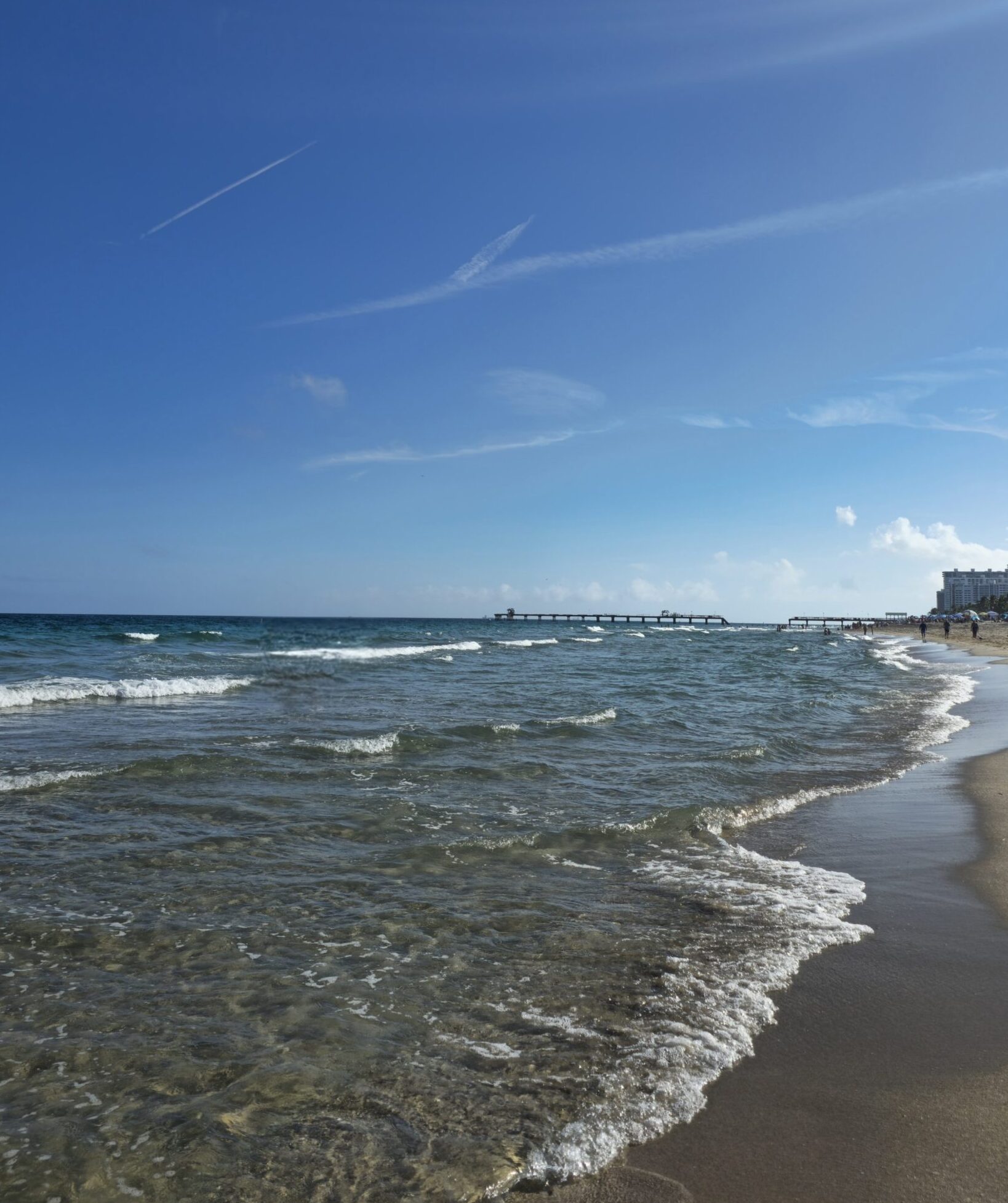 Peaceful morning beach walk in Lauderdale-by-the-Sea with soft waves and warm winter light.