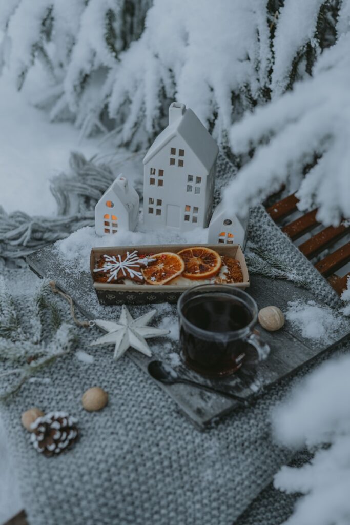 Cozy winter kitchen scene with someone cooking simple, grounding holiday meals.