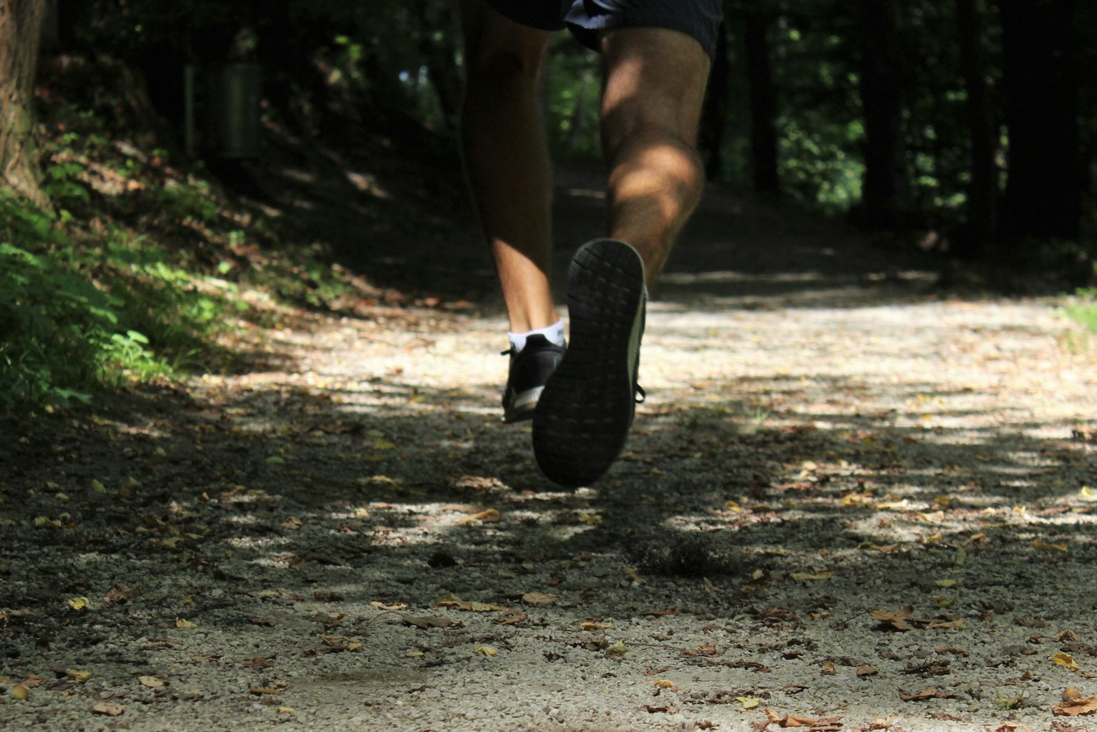Relaxed outdoor movement on a quiet trail, showing energy-focused fitness that supports everyday life.