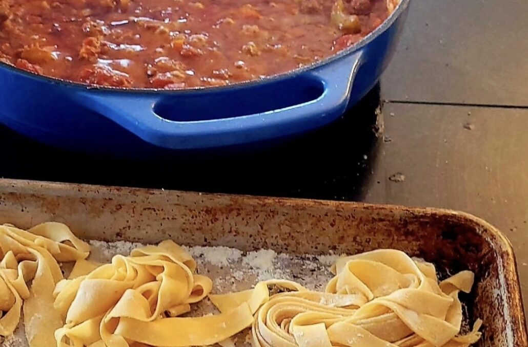 Homemade pasta on a kitchen table symbolizing a life that gives something back through simple routines